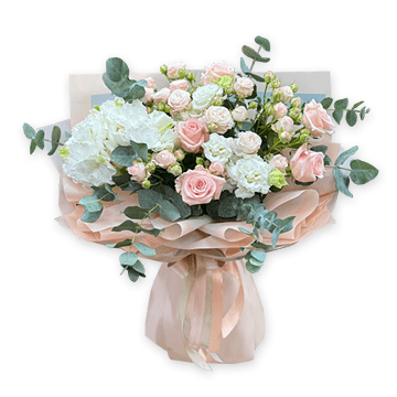 A bouquet of hydrangeas, bush roses and lisianthus.