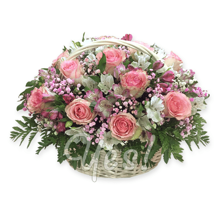 Basket with roses and alstroemerias decorated with verdure
